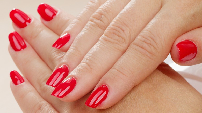 Hands with red, shellac nails