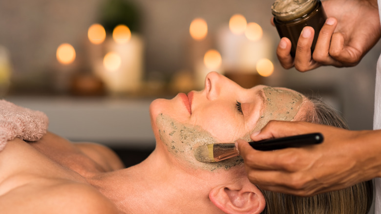 Woman getting facial treatment