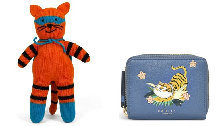 Stuffed tiger toy and blue wallet