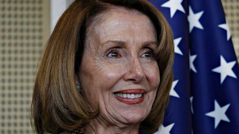 Nancy Pelosi in front of American Flag