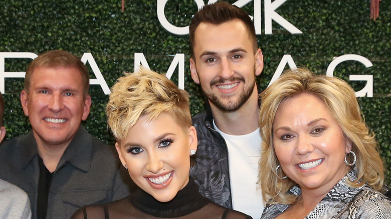 The Chrisley family pictured with Nic Kerdiles at an event