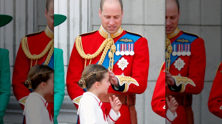 Prince William brushes hair out of Charlotte's face