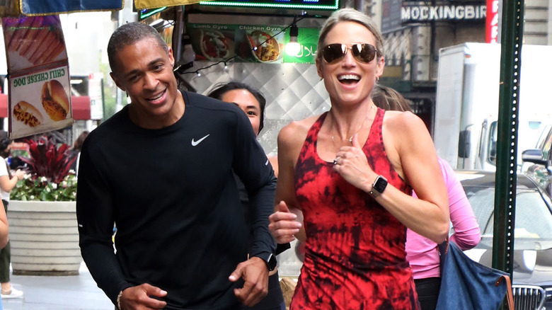 Amy Robach and T.J. Holmes running