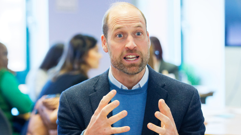 Prince William speaking while holding hands at chest level