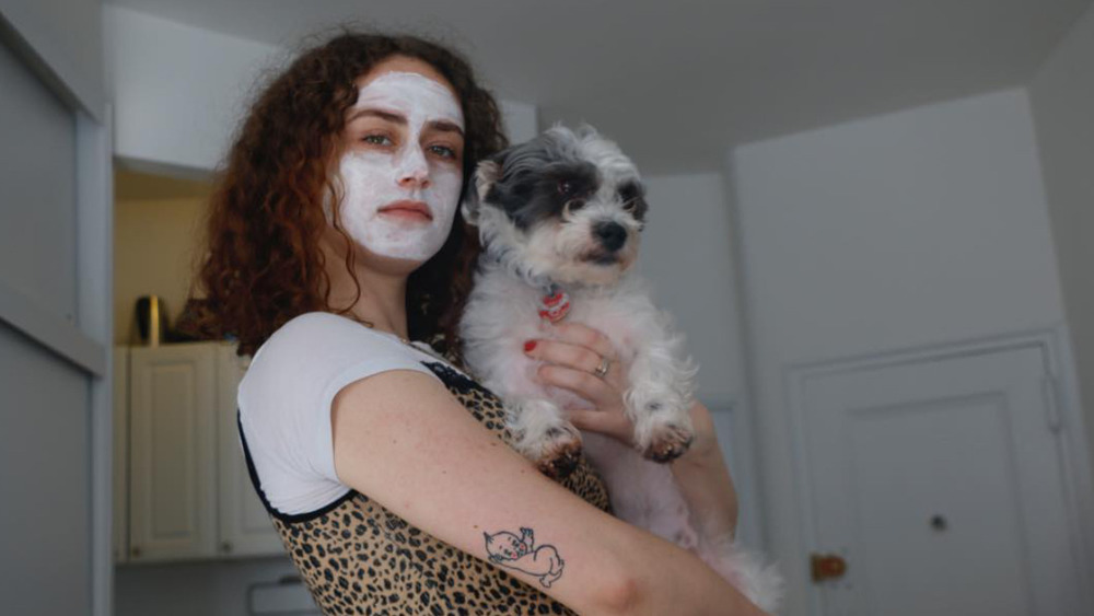 Ella Emhoff holding a dog