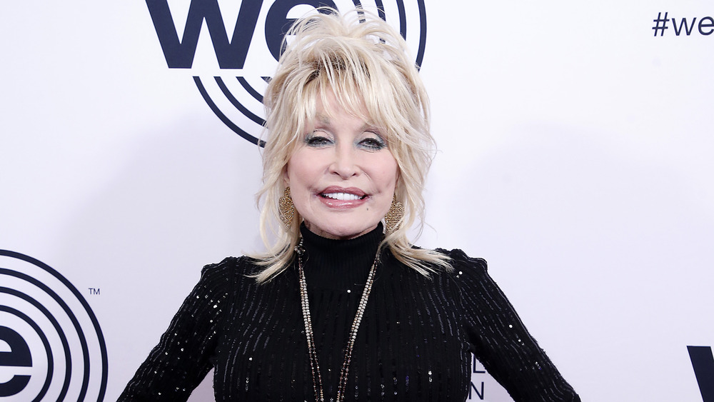 Dolly Parton smiling and wearing black