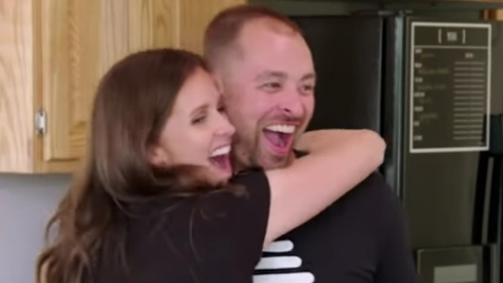 Spencer and Erica Shemwell hugging on camera