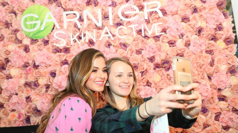 Jojo Fletcher and a fan pose for a photo