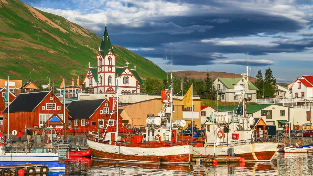 sail boats docked in small harbor