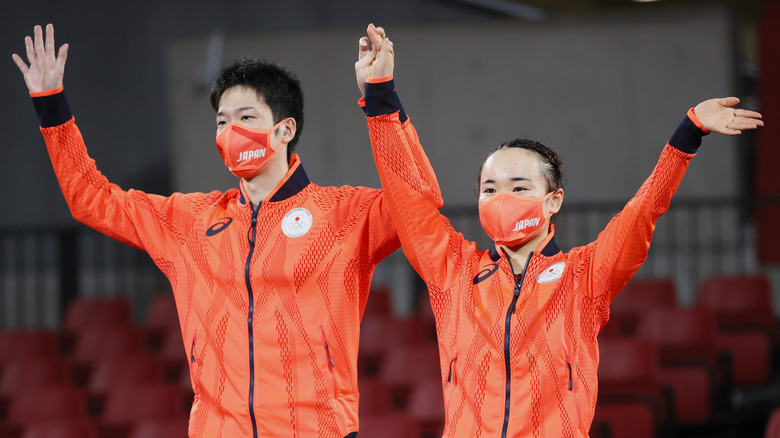 A male and female athlete in the Tokyo Olympics