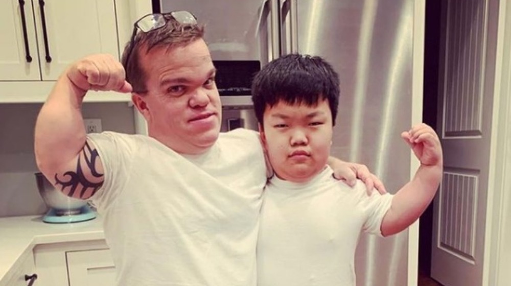 Alex Johnston flexing with his dad in the kitchen