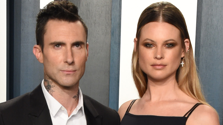 Adam Levine (L) and Behati Prinsloo attend the 2020 Vanity Fair Oscar Party hosted by Radhika Jones at Wallis Annenberg Center for the Performing Arts on February 09, 2020 in Beverly Hills, California. 