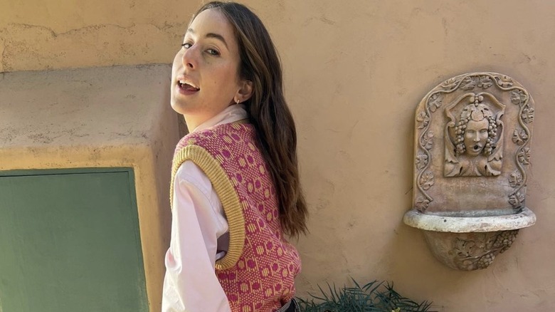 Alana Haim on a balcony