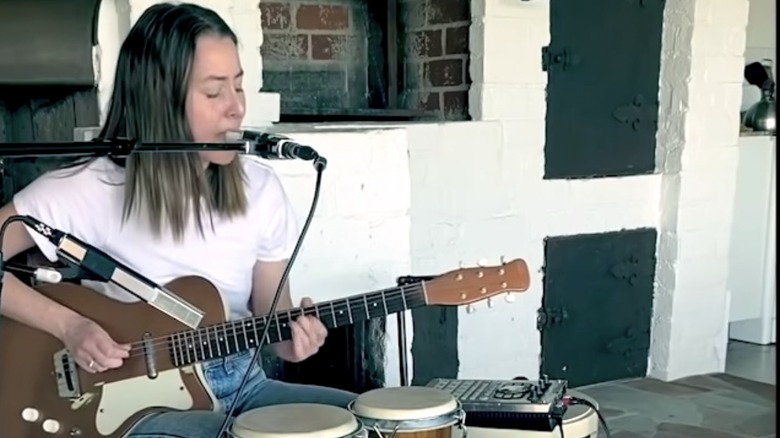 Alana Haim performing at home