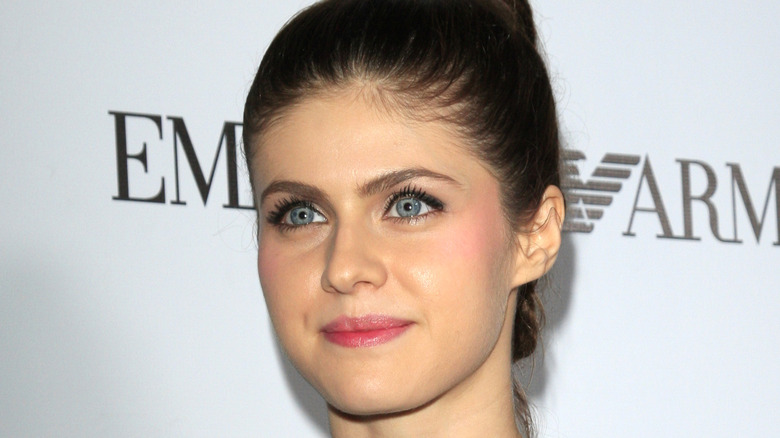 Alexandra Daddario looking off to the side