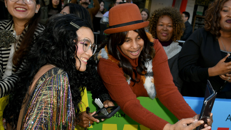 Ali Wong taking a selfie with a fan