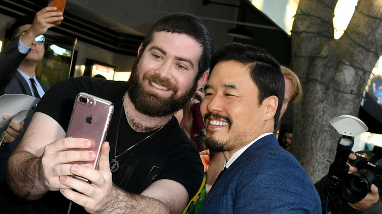 Randall Park taking a selfie with a fan