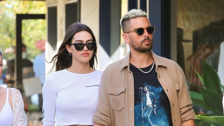 Amelia Hamlin and Scott Disick walking