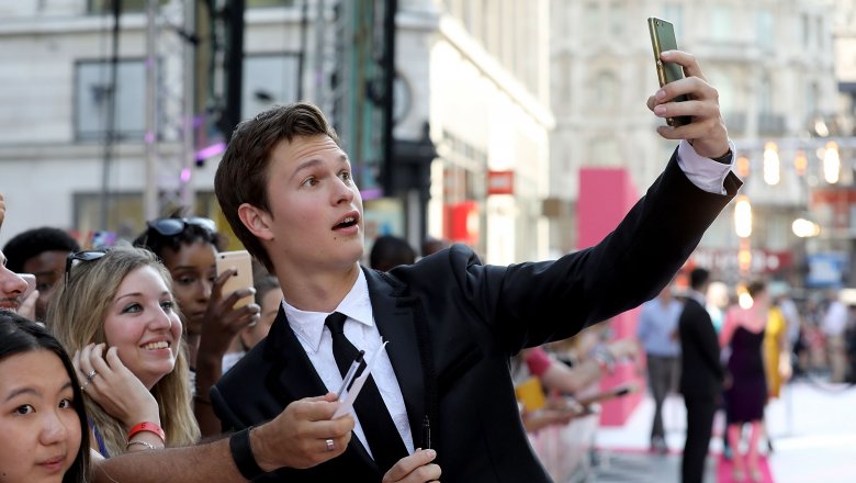 Ansel Elgort taking selfies with fans