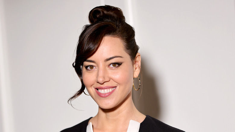 Aubrey Plaza smiling on the red carpet