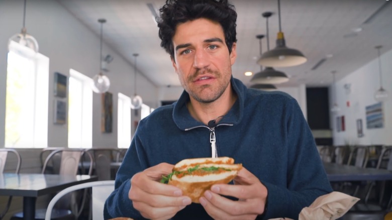 Joe Amabile eating a sandwich