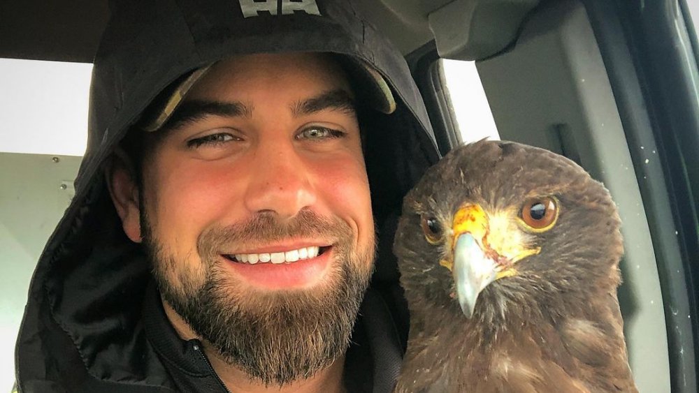 Blake Moynes posing with a bird