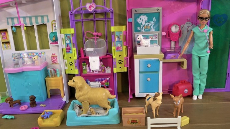 Barbie as a vet with several animals