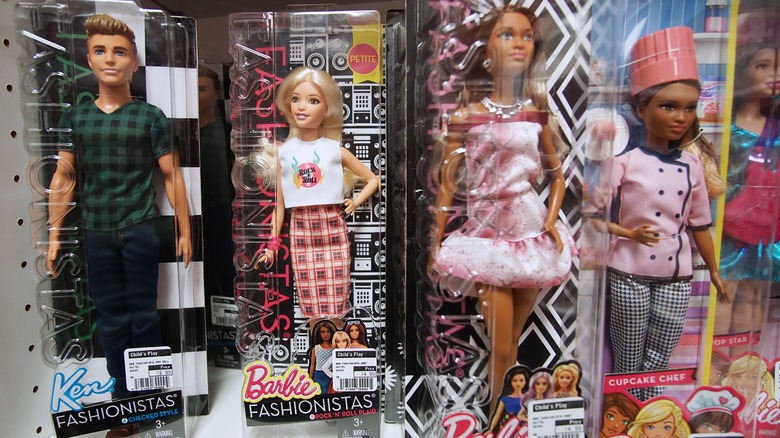 Barbies in boxes on shelf