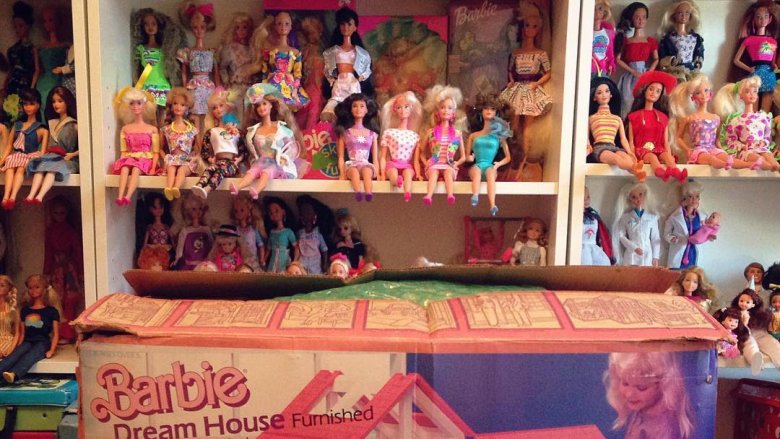 Dozens of Barbies on shelves