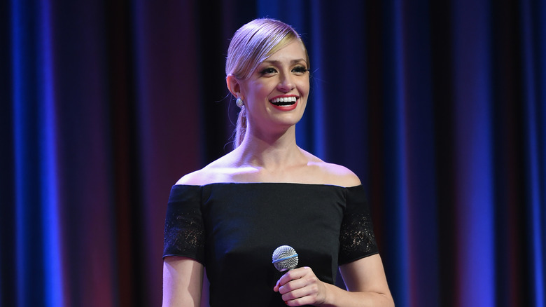 Beth Behrs laughs on stage