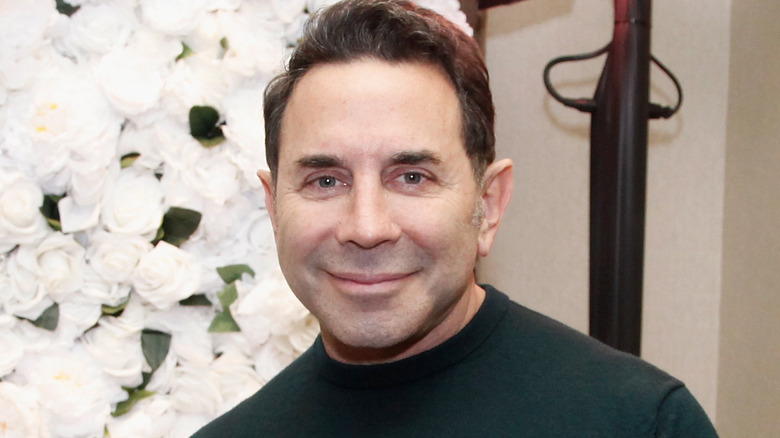 Dr. Paul Nassif smiling at camera