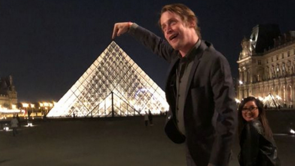 Macaulay Culkin and Brenda Song goofing off in Paris