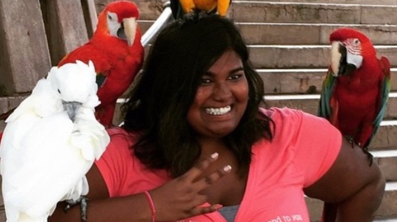 Bridget McCain posing with birds