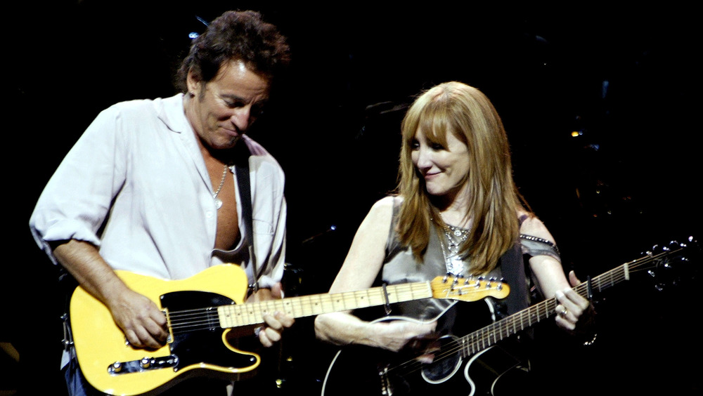 Bruce Springsteen and Patti Scialfa playing guitar together
