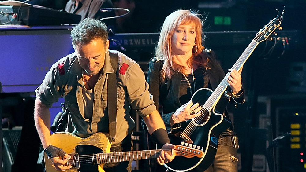 Bruce Springsteen and Patti Scialfa performing on stage