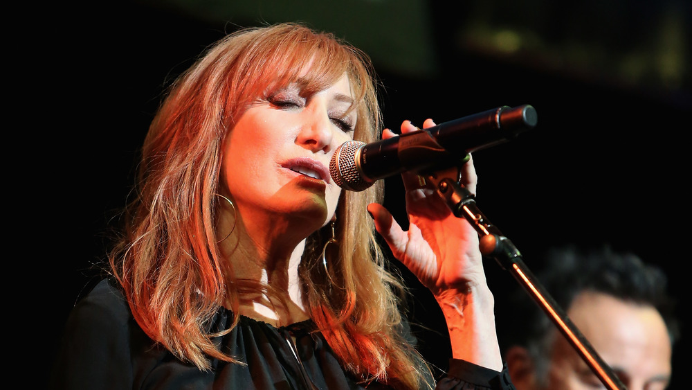 Patti Scialfa singing into a microphone