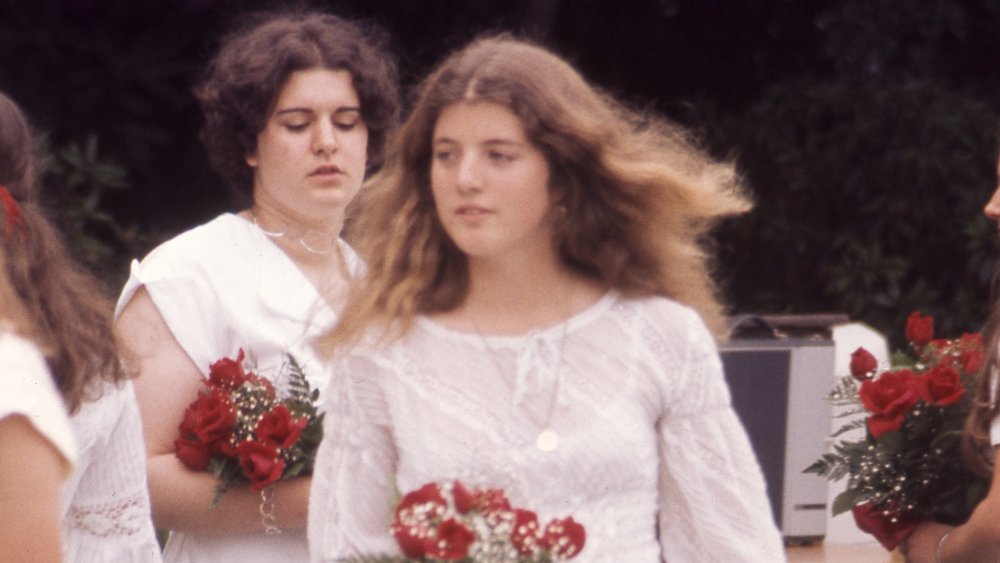 Caroline Kennedy as a teenager carrying roses