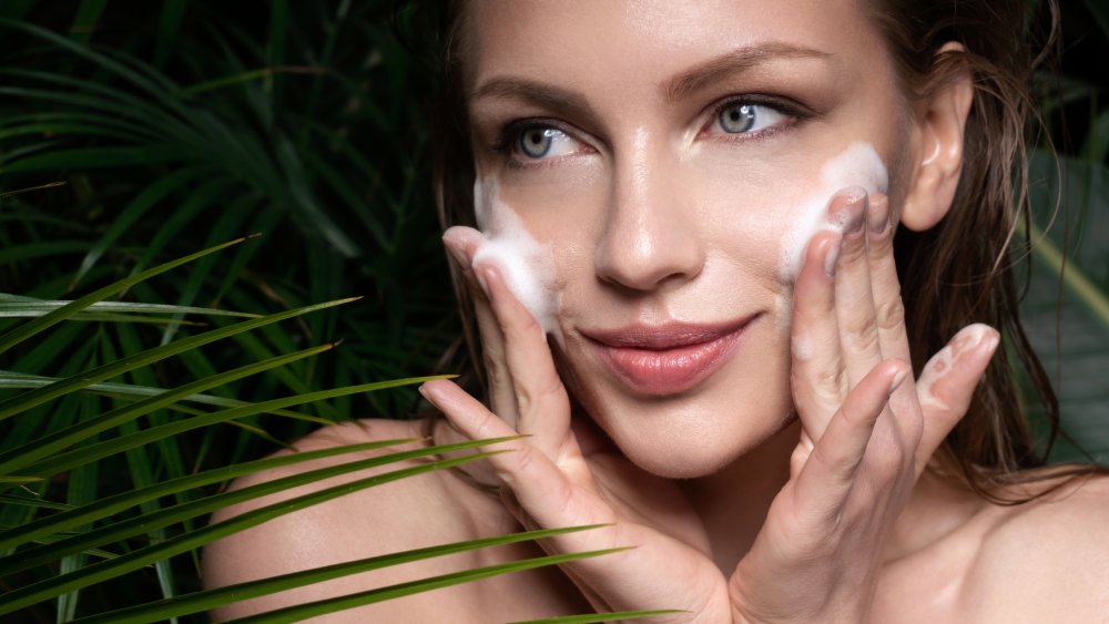 woman applying clean beauty product