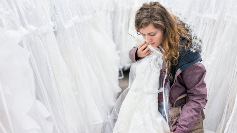 Woman looking for a wedding dress in store