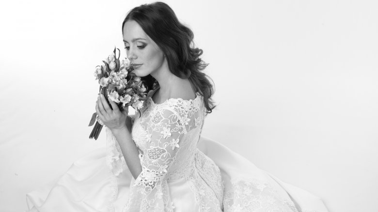 Bride in wedding gown posing