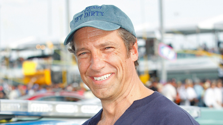 Mike Rowe smiling in hat