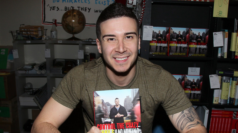 Vinny Guadagnino holding his book