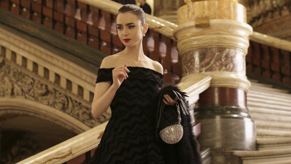 Lily Collins on a grand staircase in Emily in Paris