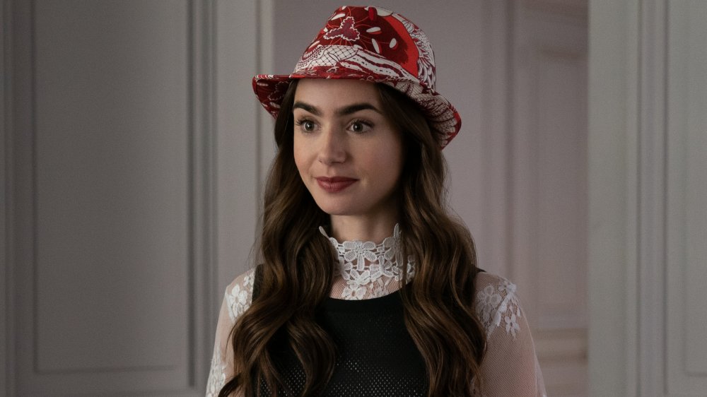 Lily Collins in Emily in paris, wearing a red hat