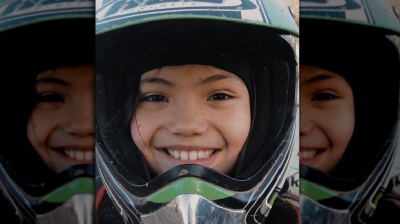 Emma Raducanu as a child on a bike