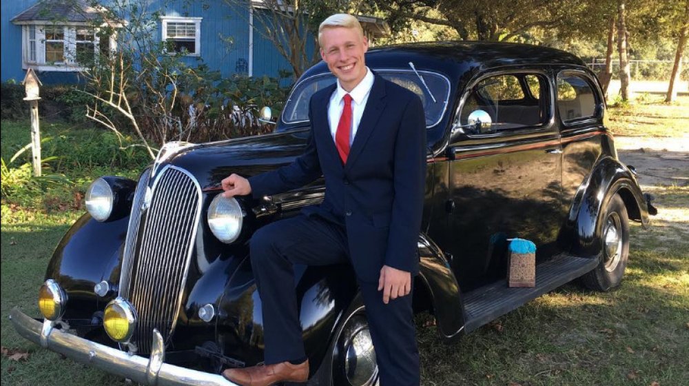 Ethan Plath with one of his classic cars