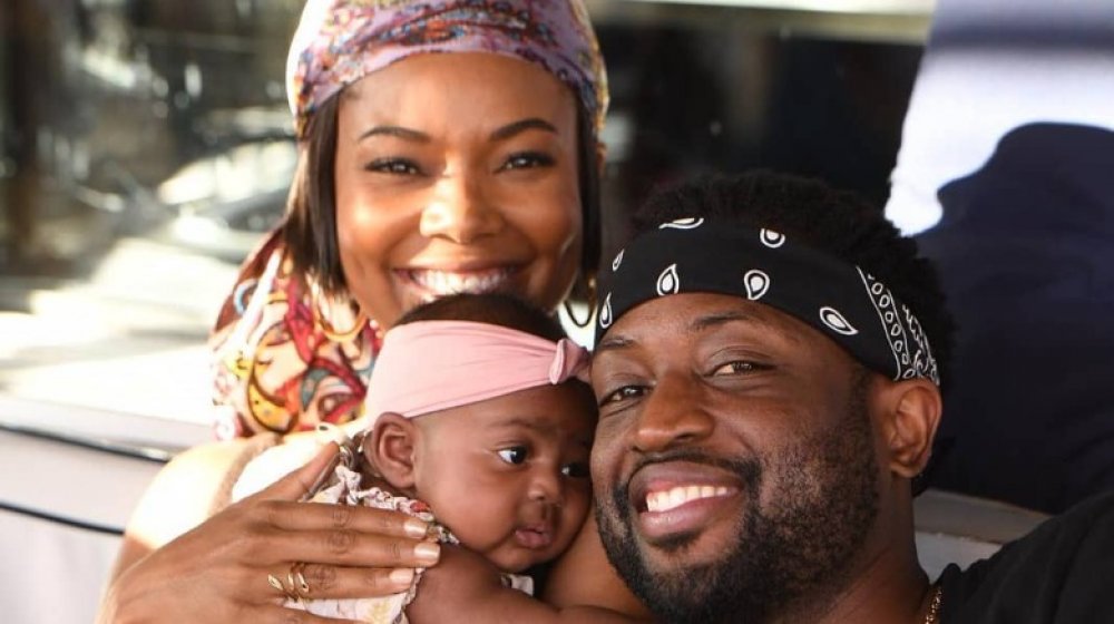 Gabrielle Union with her husband and baby