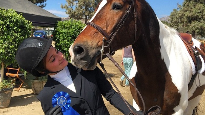 Gigi Caruso with a horse