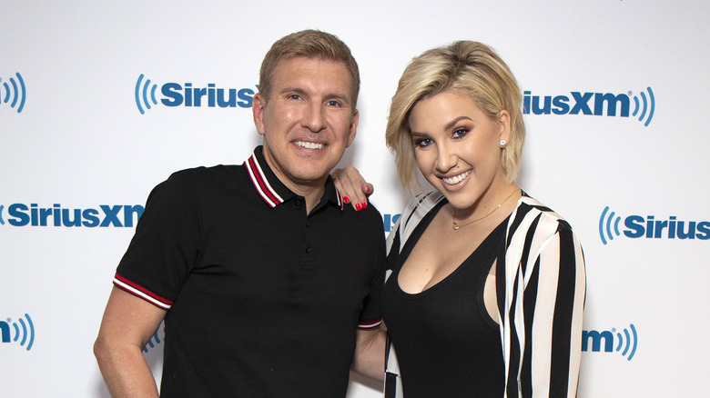 Savannah Chrisley posing with her dad 