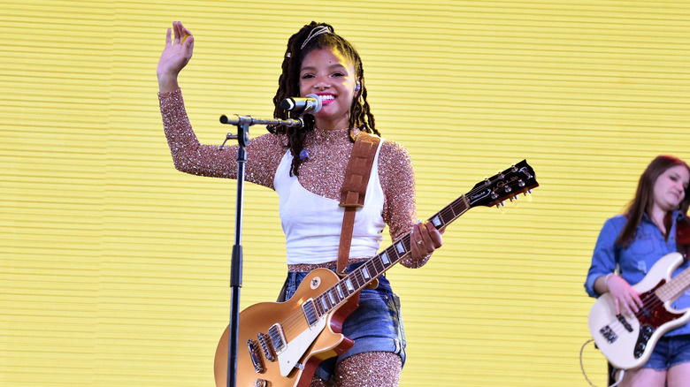 Halle Bailey playing guitar at Coachella